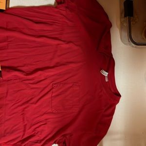 Red cropped baby tee! Has a small pocket in the front!